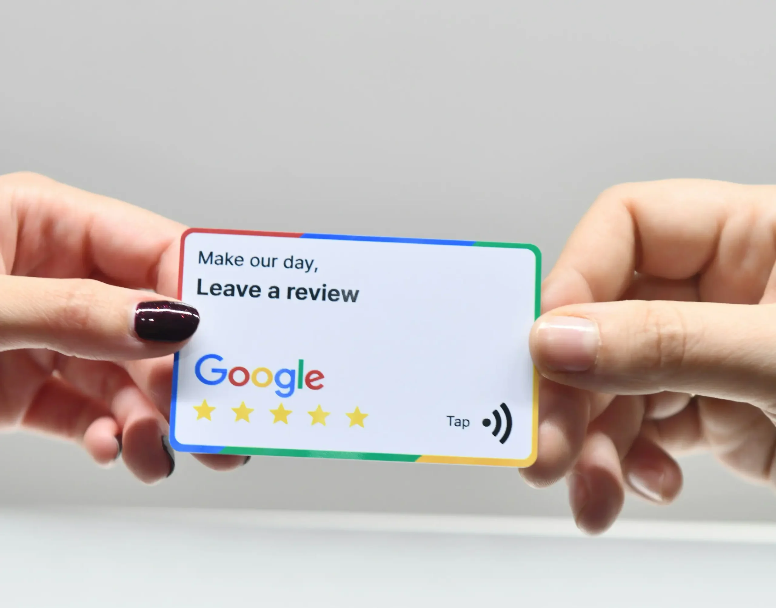 Customers holding a card encouraging reviews with Google logo – Express Blinds, trusted window treatment provider in San Diego.